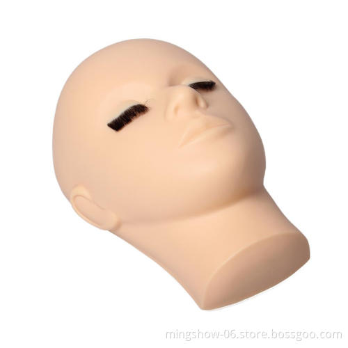 Hand-painted mannequin head with eyelashes training